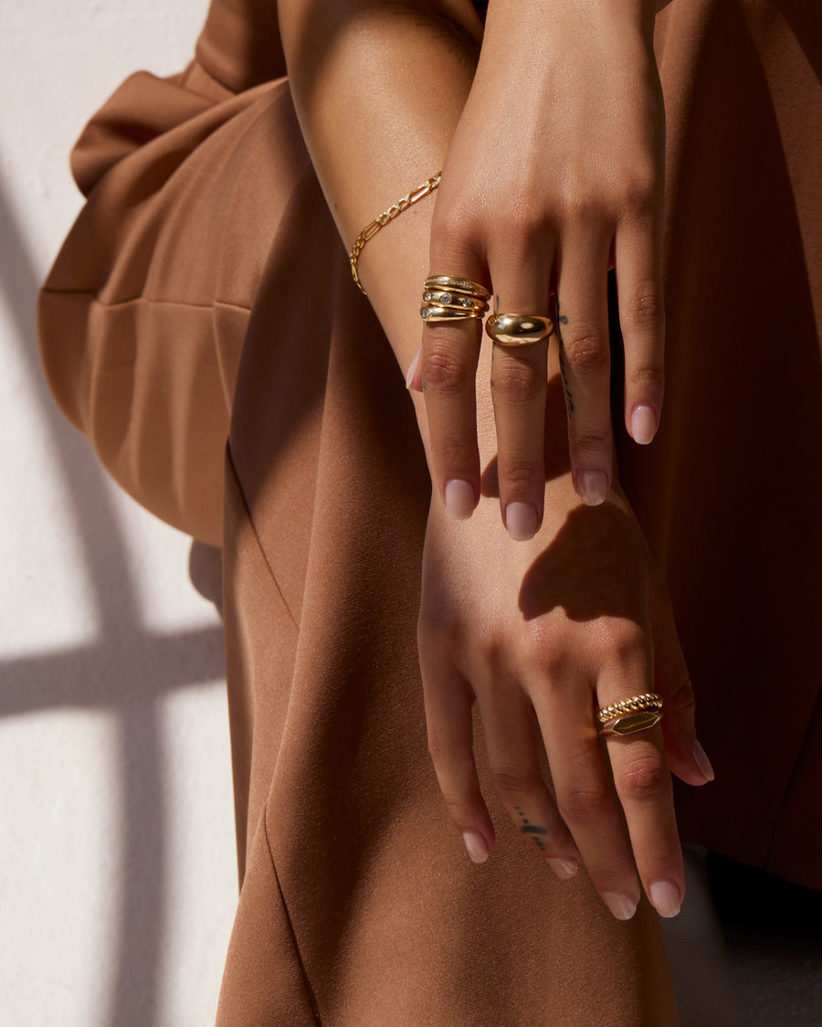 THE DOME RING WITH THREE ROUND DIAMONDS